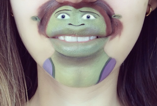 Illustration for article titled Girl transforms her mouth into cute famous characters with just makeup